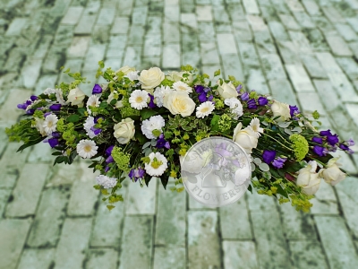 White and purple casket spray