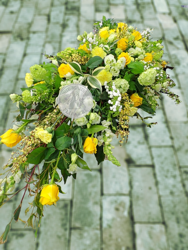 Large yellow and white casket spray