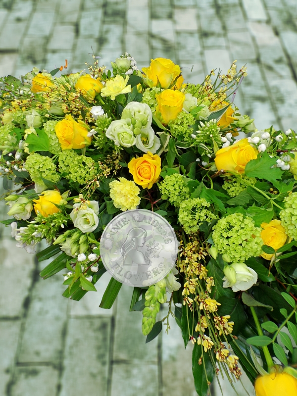 Large yellow and white casket spray