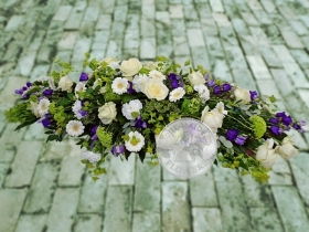 White and purple casket spray