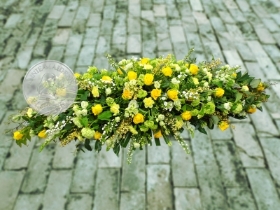 Large yellow and white casket spray